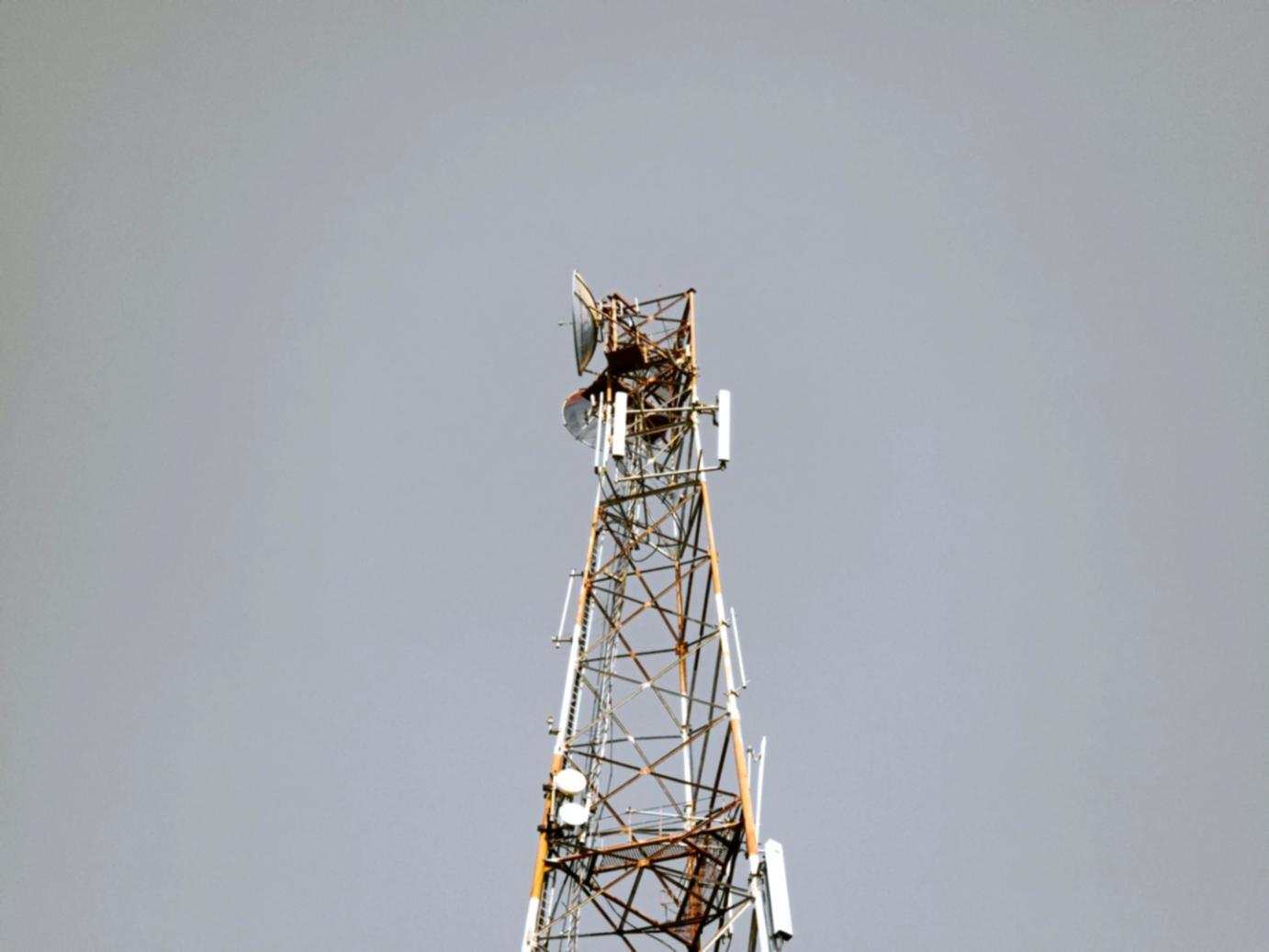 Students collaborating on wind turbine analysis project with technical diagrams and performance data